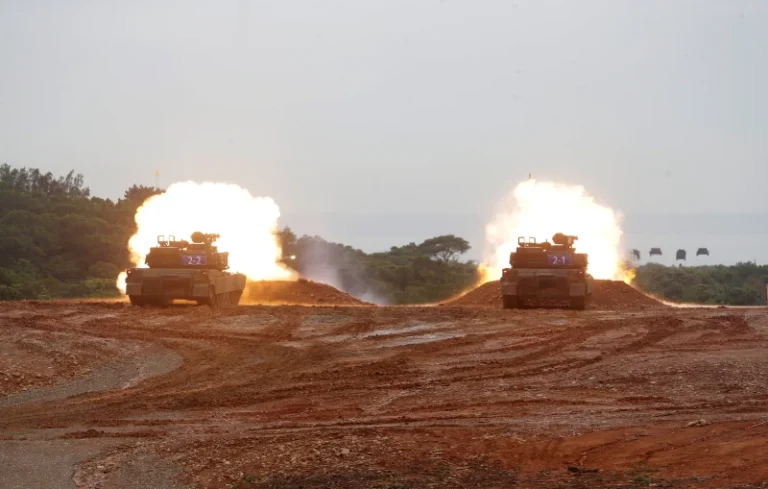 (M1A2T Abrams main battle tanks fire during a military live-fire shooting training in Taiwan. (AP Photo/Chiang Ying-ying)