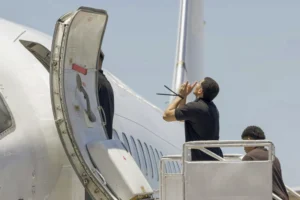 This photo released by the El Salvador’s presidential press office shows men, who El Salvador’s government identify as Venezuelans who the U.S. government detained and flew to El Salvador months ago, boarding a Venezuelan plane bound for Venezuela at the Oscar Arnulfo Romero International Airport in San Luis Talpa, El Salvador, Friday, July 18, 2025. (El Salvador’s presidential press office via AP)