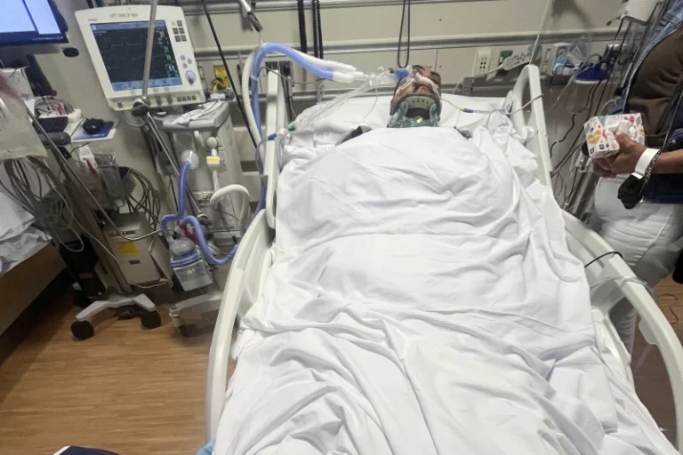 (This undated photo provided by his family shows Jaime Alanis inside Ventura County Medical Center, after he was injured during an immigration raid on Thursday, July 10, 2025 in Camarillo, Calif. (Family photo via AP)