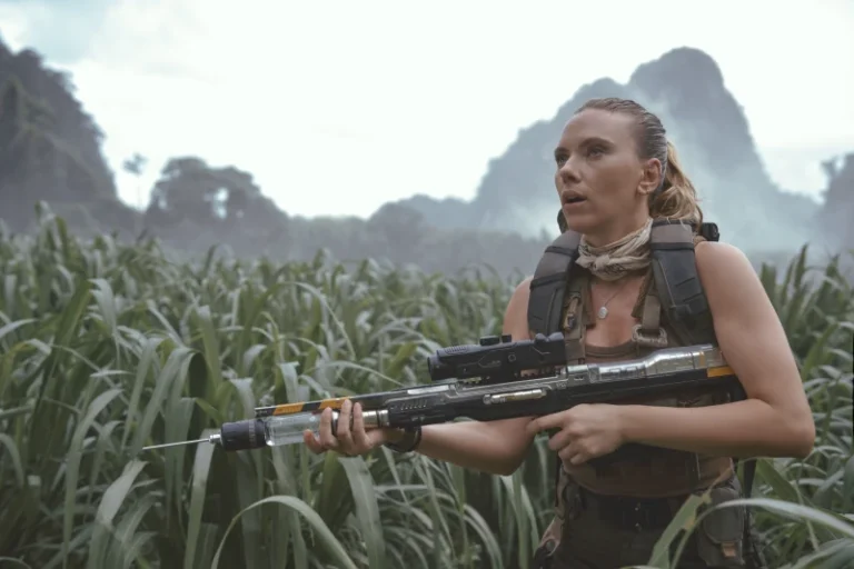 This image released by Universal Pictures and Amblin Entertainment shows Scarlett Johansson in a scene from " Jurassic World: Rebirth.” (Jasin Boland/Universal Pictures and Amblin Entertainment via AP)