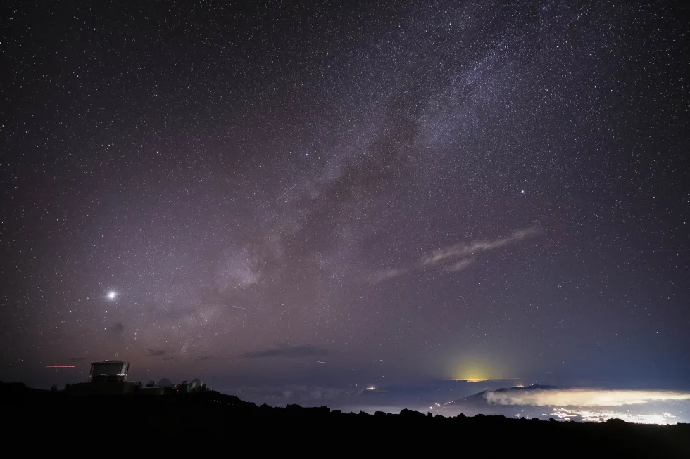 (The Milky Way is seen over the Haleakala Observatory and the lights of Kahului, at right, Saturday, Nov. 23, 2024 at the summit of Haleakala National Park near Kula, Hawaii. (AP Photo/Lindsey Wasson, File)