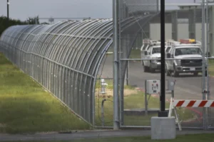 Trucks drive at the Prairieland Detention Center in Alvarado, Texas, Sept. 15, 2016. (Louis DeLuca/The Dallas Morning News via AP, File)