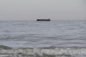 “Taxi boats” motor to pre-arranged off-shore pick-up points, where migrants waiting on the beaches then wade into the water, Friday July 4, 2205 on Hardelot beach south of Boulogne-sur-Mer, northern France. (AP Photo: John Leicester)