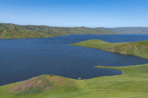 (Image of the San Luis Reservoir, the largest off-stream reservoir in the U.S. Once completed, the Sites Reservoir will be the second largest. Photo courtesy of the Department of Water Resources)