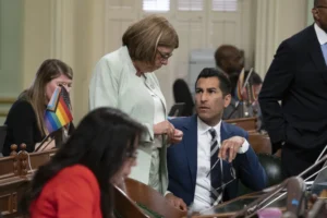 Assemblywoman Cecilia Aguilar-Curry, D-Winters, talks with Assembly Speaker Robert Rivas, D-Hollister, as lawmakers discuss the state budget at the Capitol in Sacramento, Calif., June 27, 2023. (AP Photo/Rich Pedroncelli, File)