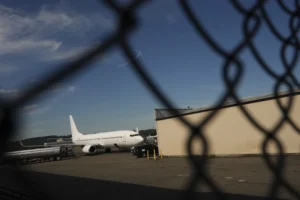 (A U.S. Immigration and Customs Enforcement flight operates out of King County International Airport-Boeing Field, Saturday, Aug. 23, 2025, in Seattle. AP Photo: Lindsey Wasson)