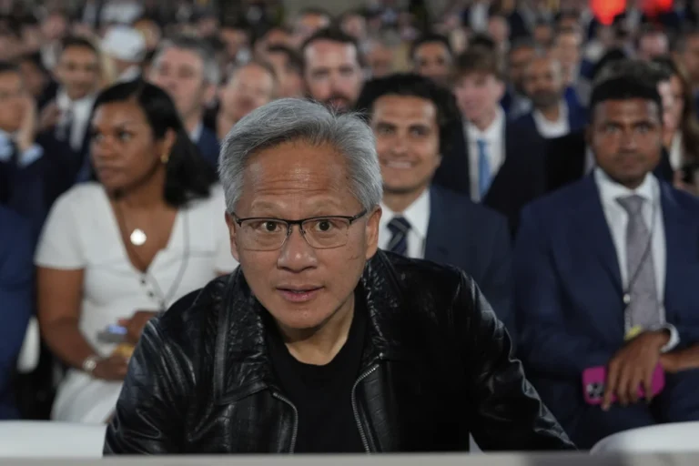 Nvidia CEO Jensen Huang arrives before President Donald Trump speaks during an AI summit at the Andrew W. Mellon Auditorium, Wednesday, July 23, 2025, in Washington. (AP Photo/Julia Demaree Nikhinson)