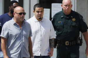 (Kilmar Abrego Garcia, center, leaves the Putnam County Jail, Friday, Aug. 22, 2025, in Cookeville, Tenn. (AP Photo/Brett Carlsen)