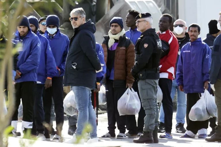 Migrants follow the authorities after their arrival in the port of Shengjin, northwestern Albania, Jan. 28, 2025. (AP Photo/Vlasov Sulaj, File)
