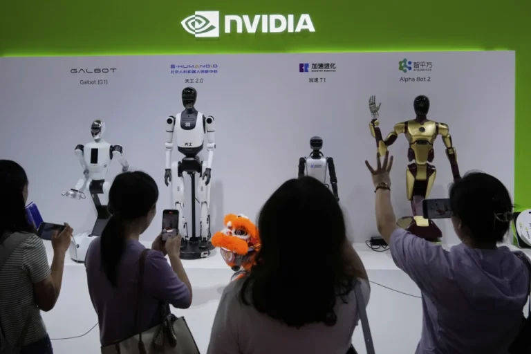 (Visitors give commands to a robot at Nvidia’s booth during the 3rd China International Supply Chain Expo at the China International Exhibition Center, in Beijing, July 18, 2025. (AP Photo/Mahesh Kumar A., File)