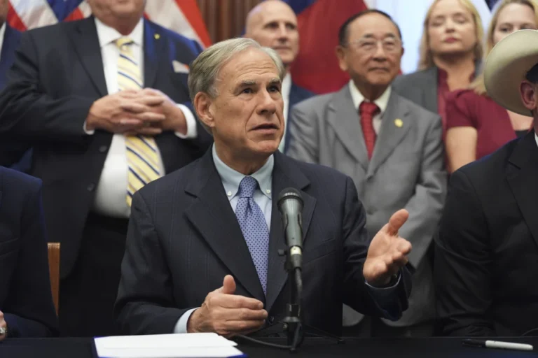 (Texas Gov. Greg Abbott speaks to the media following a bill signing as Texas senators debate a bill on a redrawn U.S. congressional map during a special session in the Senate Chamber at the Texas Capitol in Austin, Texas, Friday, Aug. 22, 2025. (AP Photo/Eric Gay)
