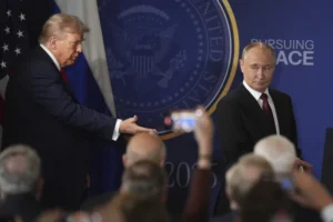 President Donald Trump, left, and Russia’s President Vladimir Putin arrive for a joint press conference at Joint Base Elmendorf-Richardson, Alaska, Friday, Aug. 15, 2025. (AP Photo/Jae C. Hong)