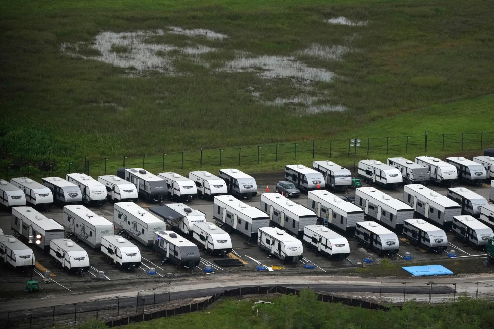 (Trailers sit parked in lines as work progresses on a migrant detention center at Dade-Collier Training and Transition facility in the Florida Everglades, July 4, 2025, in Ochopee, Fla. AP Photo: Rebecca Blackwell, file)
