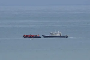 (A boat thought to carry migrants is escorted by a vessel from the French Gendarmerie Nationale in the English Channel off Wimereux beach, France, Wednesday, Sept. 4, 2024. (AP Photo: Nicolas Garriga, File)