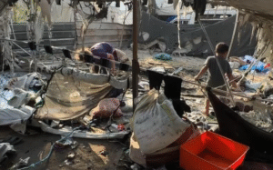 (At least 27 people were killed in the latest Israeli strikes on the Gaza Strip, according to hospital officials. In Gaza City, children combed through the debris of shelters destroyed in the strikes. Photo: AP)