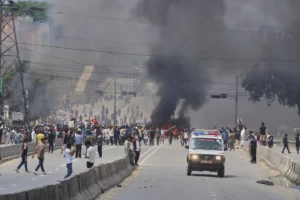 (An ambulance drives past protesters burning tires to block streets during protests against social media ban and corruption in Kathmandu, Nepal, Tuesday, Sept. 9, 2025. (AP Photo: Niranjan Shrestha)