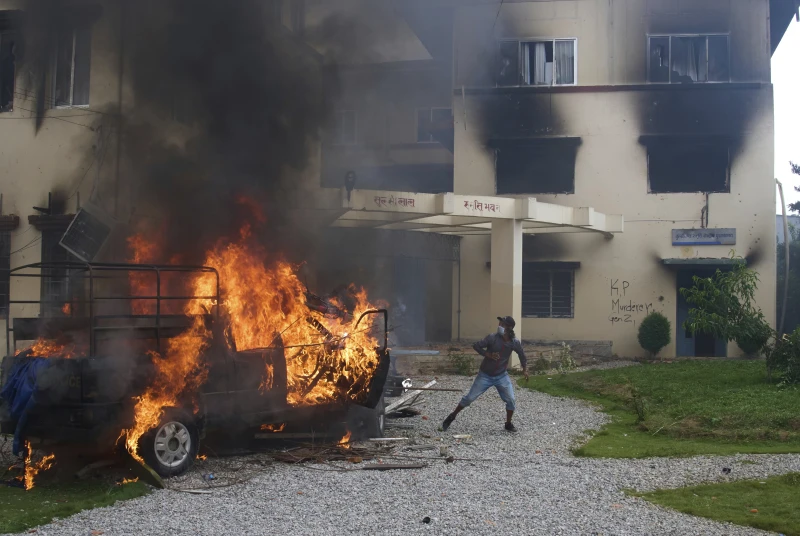 (Protesters vandalize and burn down Nepalese communist party office during protests against social media ban and corruption in Kathmandu, Nepal, Tuesday, Sept. 9, 2025. AP Photo: Niranjan Shrestha)