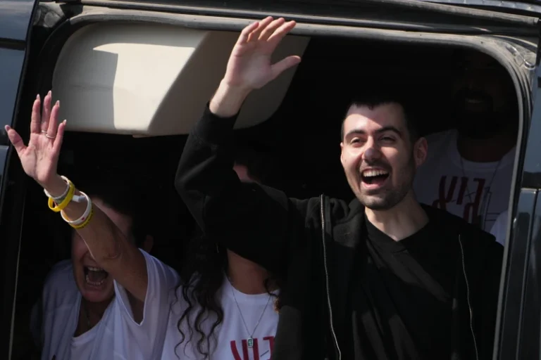 (Freed Israeli hostage Guy Gilboa-Dalal gestures from a van as he arrives at Beilinson hospital in Petah Tikva, Israel, after he was released from Hamas captivity in the Gaza Stripl, Monday, Oct. 13, 2025.  AP Photo: Ariel Schalit)