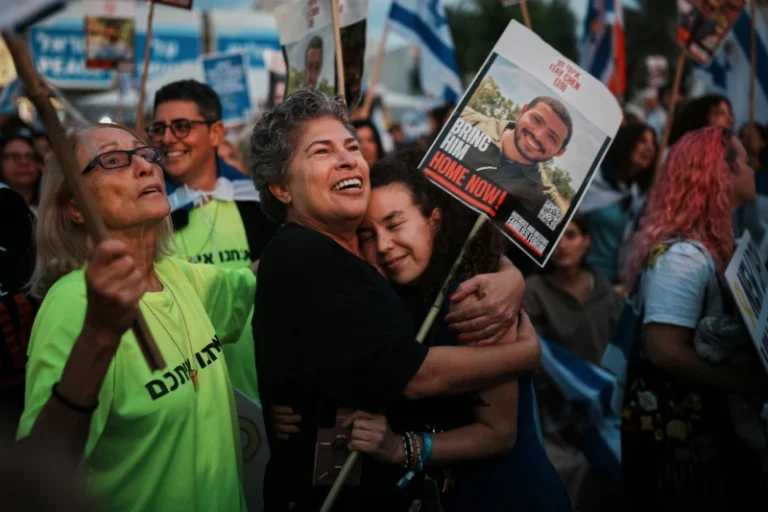 (People gather prior to the release of Israeli hostages held in Gaza, at a plaza known as the hostages square in Tel Aviv, Israel, Monday, Oct. 13, 2025. AP Photo: Emilio Morenatti)