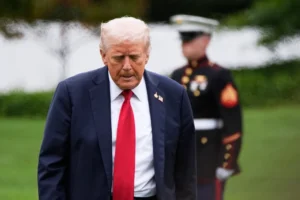 (President Donald Trump walks from Marine One after arriving on the South Lawn of the White House, Tuesday, Sept. 30, 2025, in Washington.  AP Photo: Alex Brandon)
