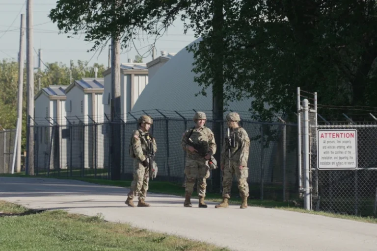 (Military personnel in uniform, with the Texas National Guard patch on, are seen at the U.S. Army Reserve Center, Wednesday, Oct. 8, 2025, in Elwood, Ill., a suburb of Chicago. (AP Photo/Laura Bargfeld)