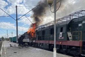 (In this photo provided by the Ukrainian Railway press office, a passenger train is engulfed in flames following Russia’s drone attack on a railway station in Shostka, Sumy region, Ukraine, Saturday, Oct. 4, 2025.  Photo: Ukrainian Railway via AP)