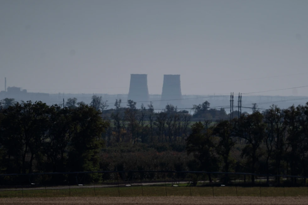 (Zaporizhzhia nuclear power plant is seen from around twenty kilometers away in an area in the Dnipropetrovsk region, Ukraine, Monday, Oct. 17, 2022.  AP Photo: Leo Correa, File)