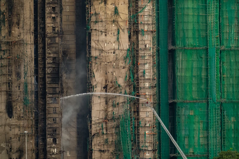 (Firefighters work to extinguish a fire which broke out Wednesday at Wang Fuk Court, a residential estate in the Tai Po district of Hong Kong’s New Territories, Thursday, Nov. 27, 2025.  AP Photo: Chan Long Hei)