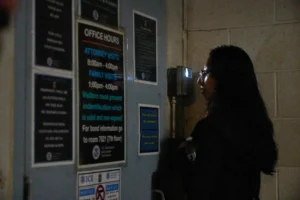 (Sociology college graduate Olivia Cortez faces a video interphone as she inquires for her father, Oliverio Cortez, an immigrant arrested by ICE at a car wash in Glendale, Calif., outside the ICE Los Angeles Staging Facility in Los Angeles, on Wednesday, June 25, 2025.  AP Photo: Damian Dovarganes, File)