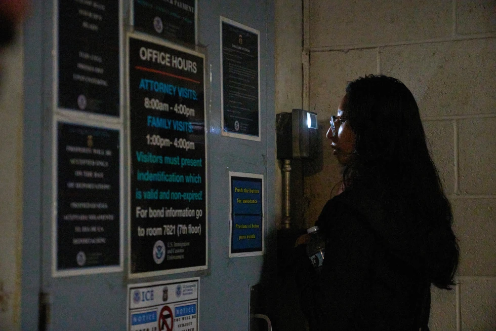 (Sociology college graduate Olivia Cortez faces a video interphone as she inquires for her father, Oliverio Cortez, an immigrant arrested by ICE at a car wash in Glendale, Calif., outside the ICE Los Angeles Staging Facility in Los Angeles, on Wednesday, June 25, 2025.  AP Photo: Damian Dovarganes, File)