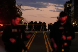 (Emergency personnel keep a presence following the shooting of two National Guard soldiers near the White House, Wednesday, Nov. 26, 2025, in Washington. (AP Photo/Mark Schiefelbein)