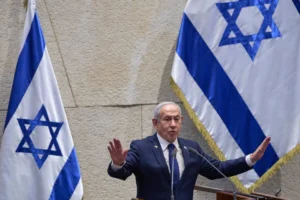 (Israel’s Prime Minister Benjamin Netanyahu addresses lawmakers in the Knesset, Israel’s parliament, in Jerusalem, Monday, Nov. 10 2025.  AP Photo: Ohad Zwigenberg)
