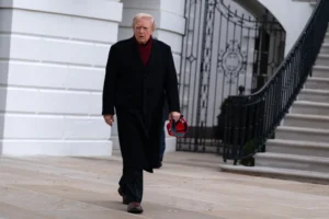 (President Donald Trump walks towards reporters from the South Lawn of the White House, Saturday, Nov. 22, 2025, in Washington, en route to Joint Base Andrews. AP Photo: Jose Luis Magana)
