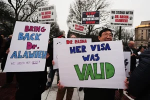 (Protesters rally outside the Rhode Island State House in support of deported Brown University Dr. Rasha Alawieh, March 17, 2025, in Providence, R.I.  AP Photo: Charles Krupa, File)