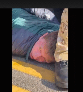 (A car crash in a Chicago suburb involving a U.S. Border Patrol vehicle led to a violent arrest caught on video showing an agent repeatedly punching a man in the head while pinned to the ground. Photo: AP)
