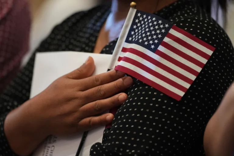 Woman clutches US Flag