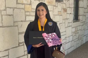 (In this undated photo provided by her attorney, Todd Pomerleau, Any Lucia Lopez Belloza celebrates her high school graduation in Texas.  Photo: Any Lucia Lopez Belloza’s attorney via AP)