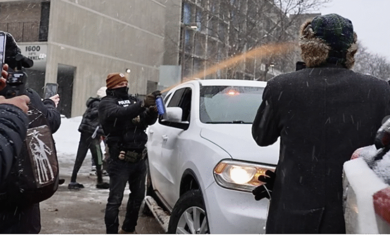 (Activists confronted a group of Immigration and Customs Enforcement officers in Minneapolis’ Cedar-Riverside neighborhood on Tuesday afternoon.  AP Photo: Mark Vancleave)
