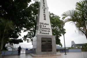 (A police officer walks by a monument honoring 150 years of the Chinese community in Panama City, June 13, 2017.  AP Photo: Arnulfo Franco, File)