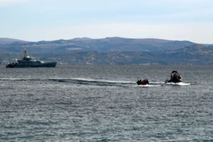 (In this Friday, Feb. 28, 2020 file photo, refugees and migrants arrive in a dinghy accompanied by Frontex vessels at the village of Skala Sikaminias, on the Greek island of Lesbos, after crossing the Aegean sea from Turkey. AP Photo: Michael Varaklas, File)
