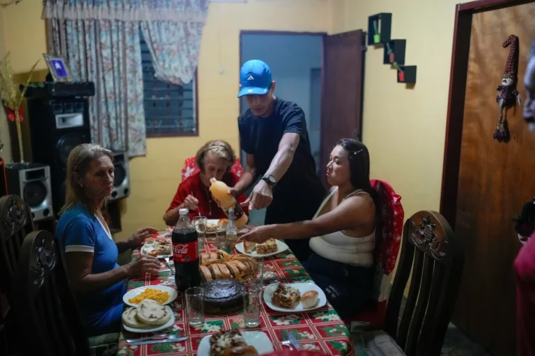 (Mariela Gómez, right, and her partner Abraham Castro, a Venezuelan migrant couple, sit for Christmas dinner at Castro’s parents’ home in Maracay, Venezuela, early Thursday, Dec. 25, 2025. The couple abandoned their journey to the United States and returned home from Mexico by land and sea following President Donald Trump’s immigration crackdown.  AP Photo: Matias Delacroix)