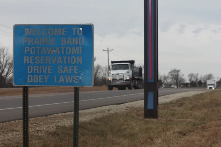 (A sign on a road off of U.S. Highway 75 welcomes motorists to the Prairie Band Potawatomi reservation, outside Mayetta, Kan., Thursday, Dec. 11, 2025.  AP Photo: John Hanna)