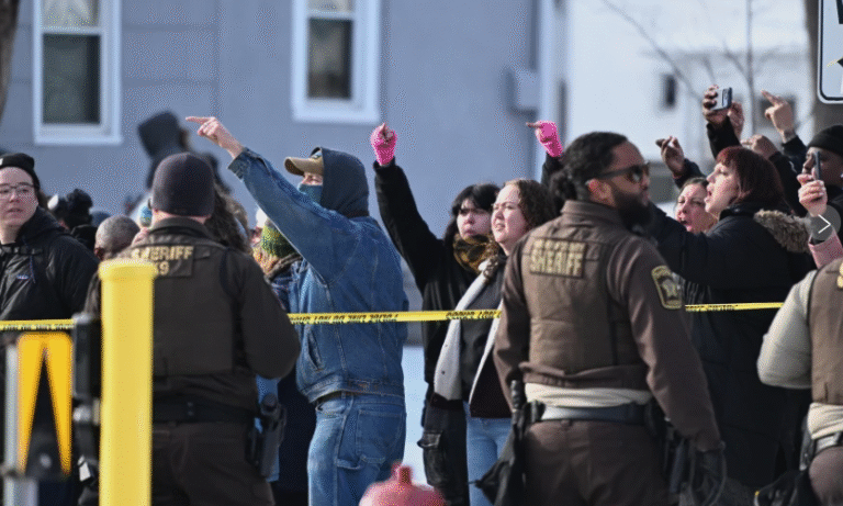 (ICE agent shoots and kills a woman during the Minneapolis immigration crackdown. The shooting drew a crowd of angry demonstrators (AP  Photo: Tim Sullivan)