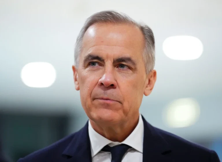 (Canada Prime Minister Mark Carney makes his way to take part in an event tilted “Country Strategy Dialogue: Canada” as he attends the World Economic Forum in Davos, Switzerland on Tuesday, Jan. 20, 2026. (Sean Kilpatrick/The Canadian Press via AP)