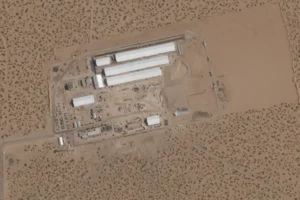 (This Aug. 7, 2025, satellite image shows construction of large white tents for a new immigrant detention center at Fort Bliss, a U.S. Army base outside El Paso, Texas. (Planet Labs via AP, File)