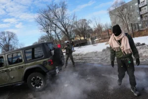 (Federal immigration officers deploy pepper balls at a protester Monday, Jan. 12, 2026, in Minneapolis.  AP Photo: Adam Gray)