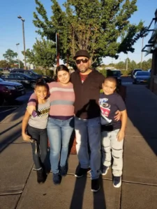 (This undated photo provided by Jeanette Pagan-Lopez shows Geraldo Lunas Campos with his three children. Lunas Campos died Jan. 3, 2026, at an ICE detention facility in El Paso, Texas. Photo: Jeanette Pagan-Lopez via AP)