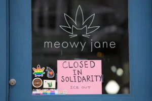 (A sign at a cannabis shop indicates it is closed for the general strike to support the state’s immigrant community Friday, Jan. 30, 2026, in Portland, Maine.  AP Photo: Robert F. Bukaty)