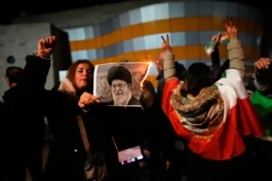 (Demonstrators burn a poster depicting Iran's Supreme Leader Ayatollah Ali Khamenei during a rally in support of anti-government protests in Iran, in Holon, Israel Wednesday, Jan. 14, 2026. (AP Photo: Ohad Zwigenberg)