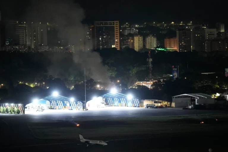 (Smoke raises at La Carlota airport after explosions and low-flying aircraft were heard in Caracas, Venezuela, Saturday, Jan. 3, 2026.  AP Photo: Matias Delacroix)